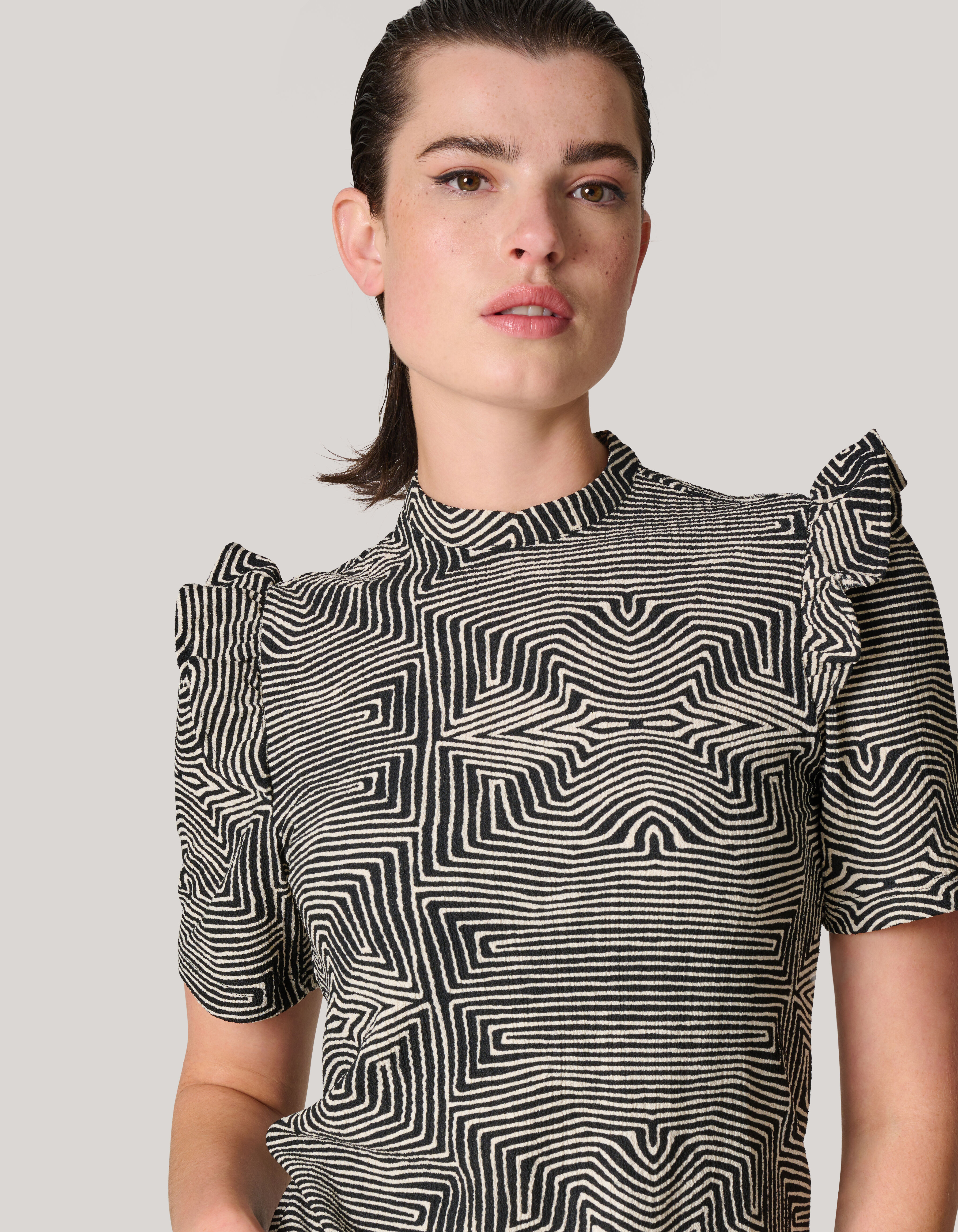 Black and white ruffle top sales